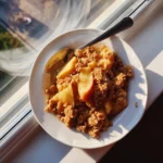 Finished crockpot apple crisp ready to serve